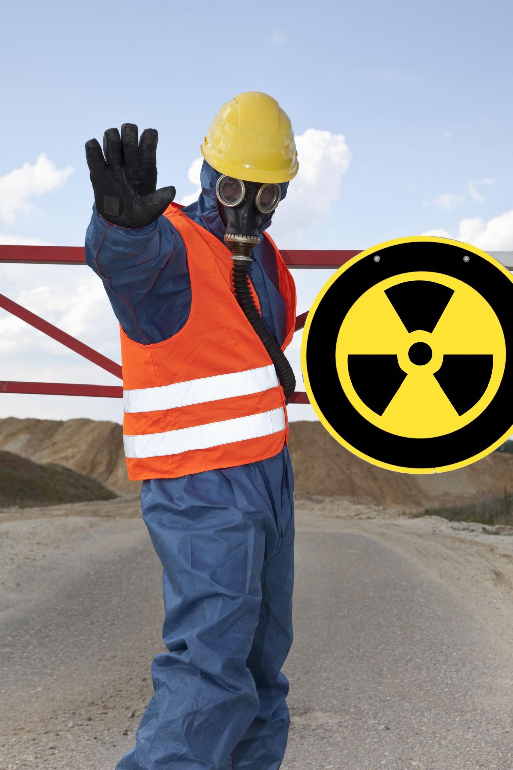 Germany, Man in protective workwear near radioactive warning symbol
