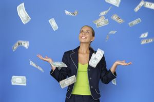money falling around a businesswoman