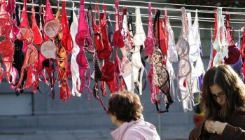 An elderly woman looks at the 1,500 bras
