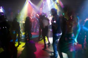 People dancing in night club