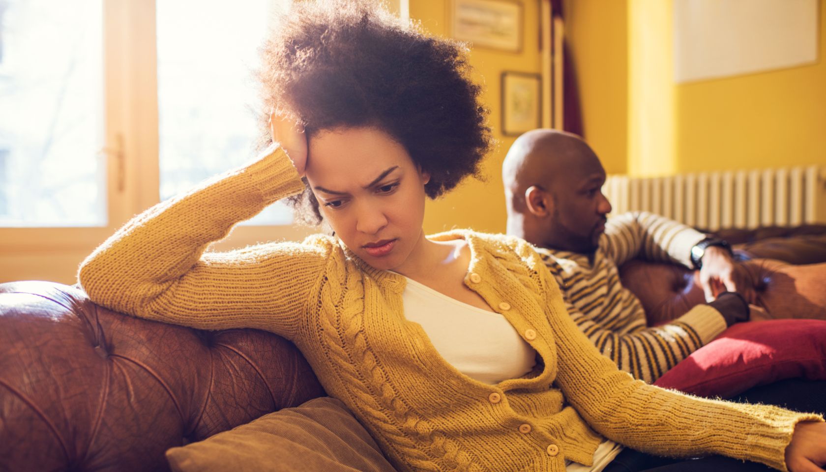 African American couple having relationship difficulties at home.