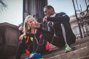 Young fit couple relaxing after the strenuous workout