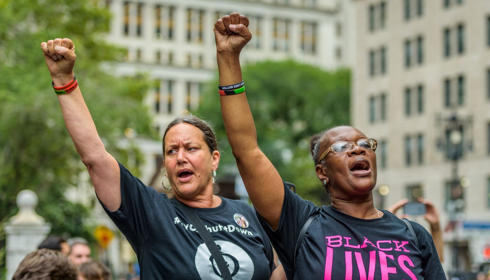 The families of victims of police brutality, community...