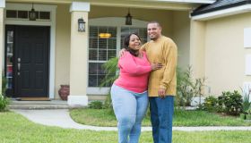 Young African American couple outside home