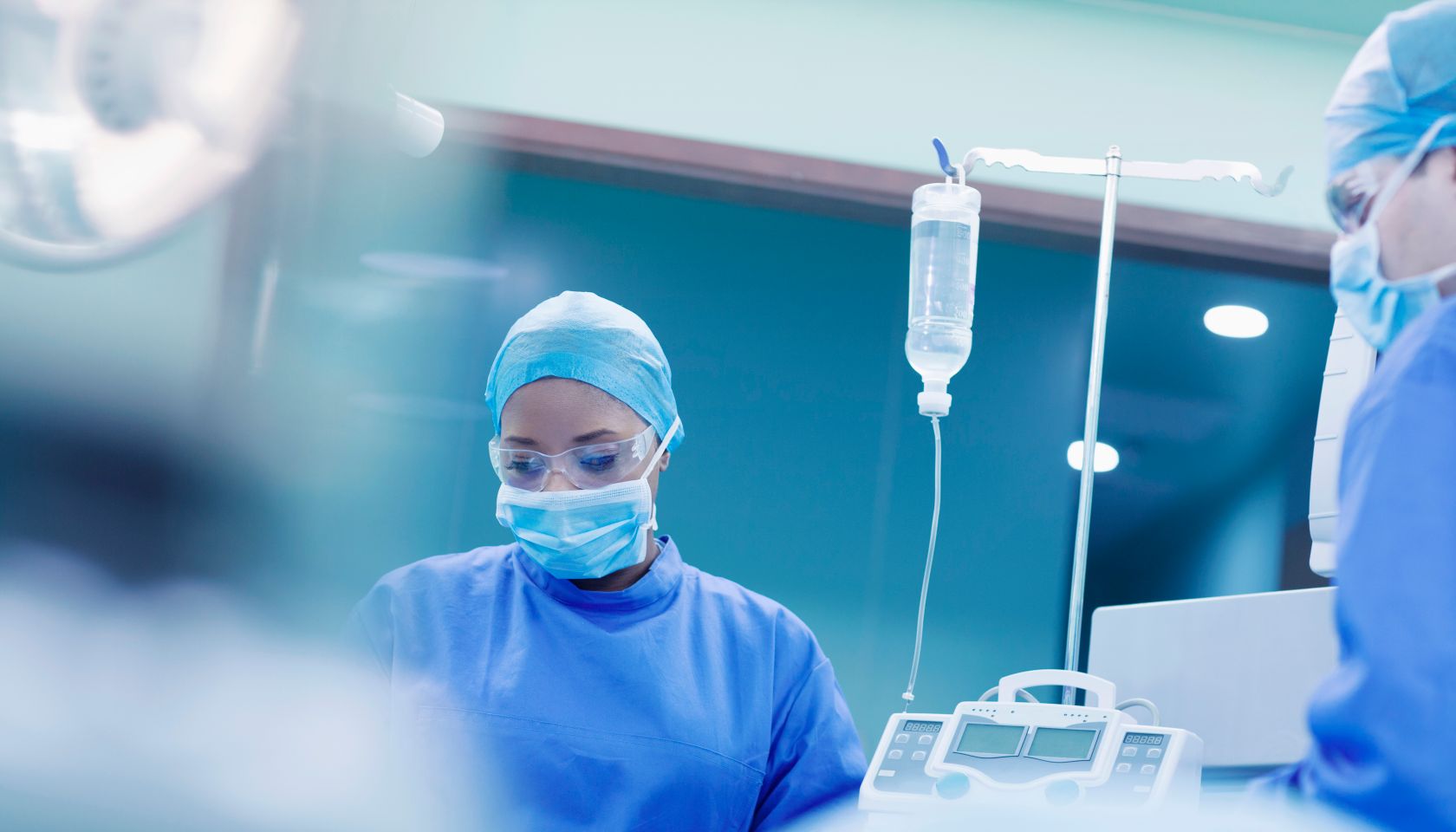 Doctors performing surgery in hospital operating room