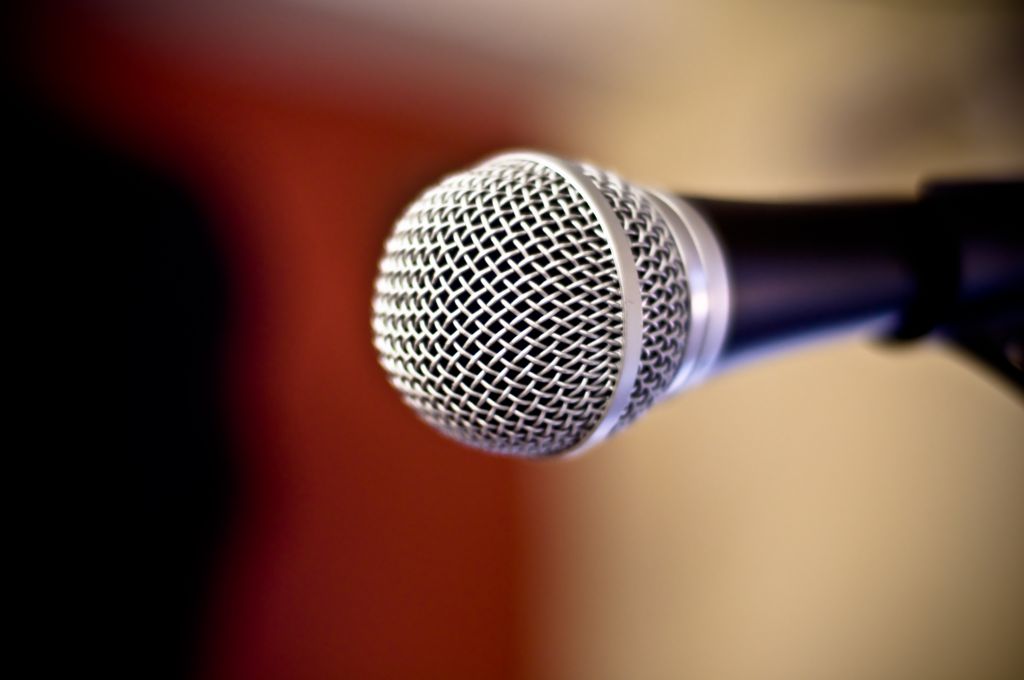 Close up of metal microphone against defocused background