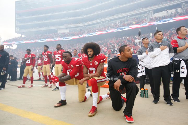 Colin Kaepernick Kneels In Silence Protest During Game