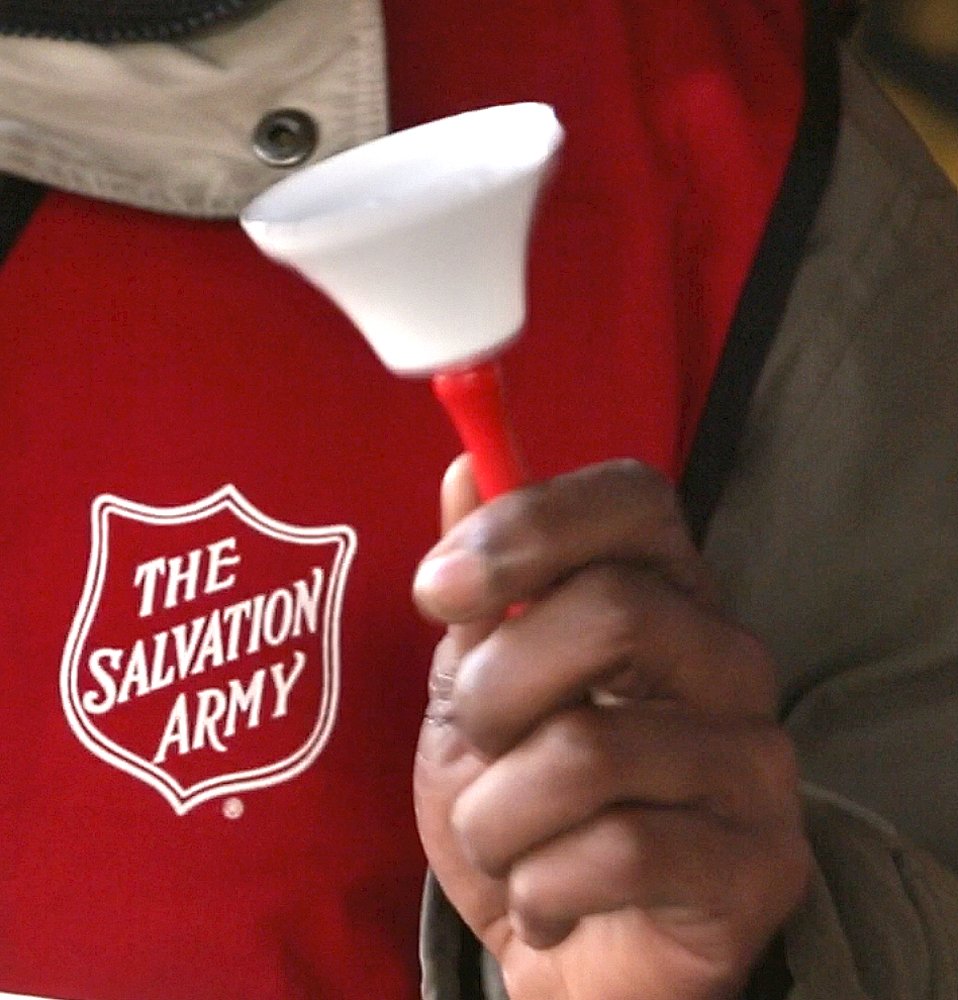Danny Mitchell rings the bell at a Salvation Army donation kettle at Cabela's in Scarborough on Wedn