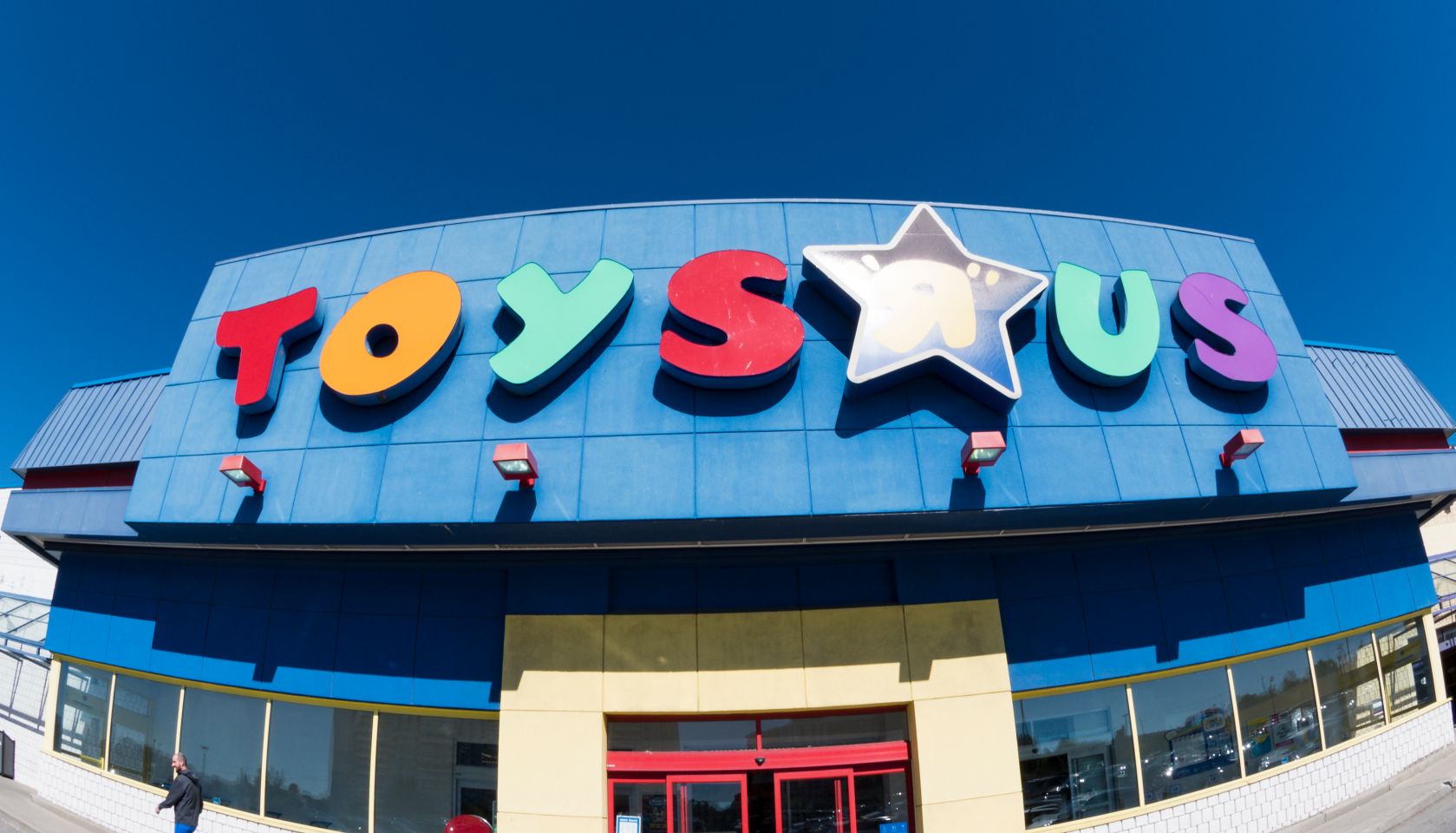 Toys R Us store facade in daytime. Toys 'R' Us, Inc. is an...