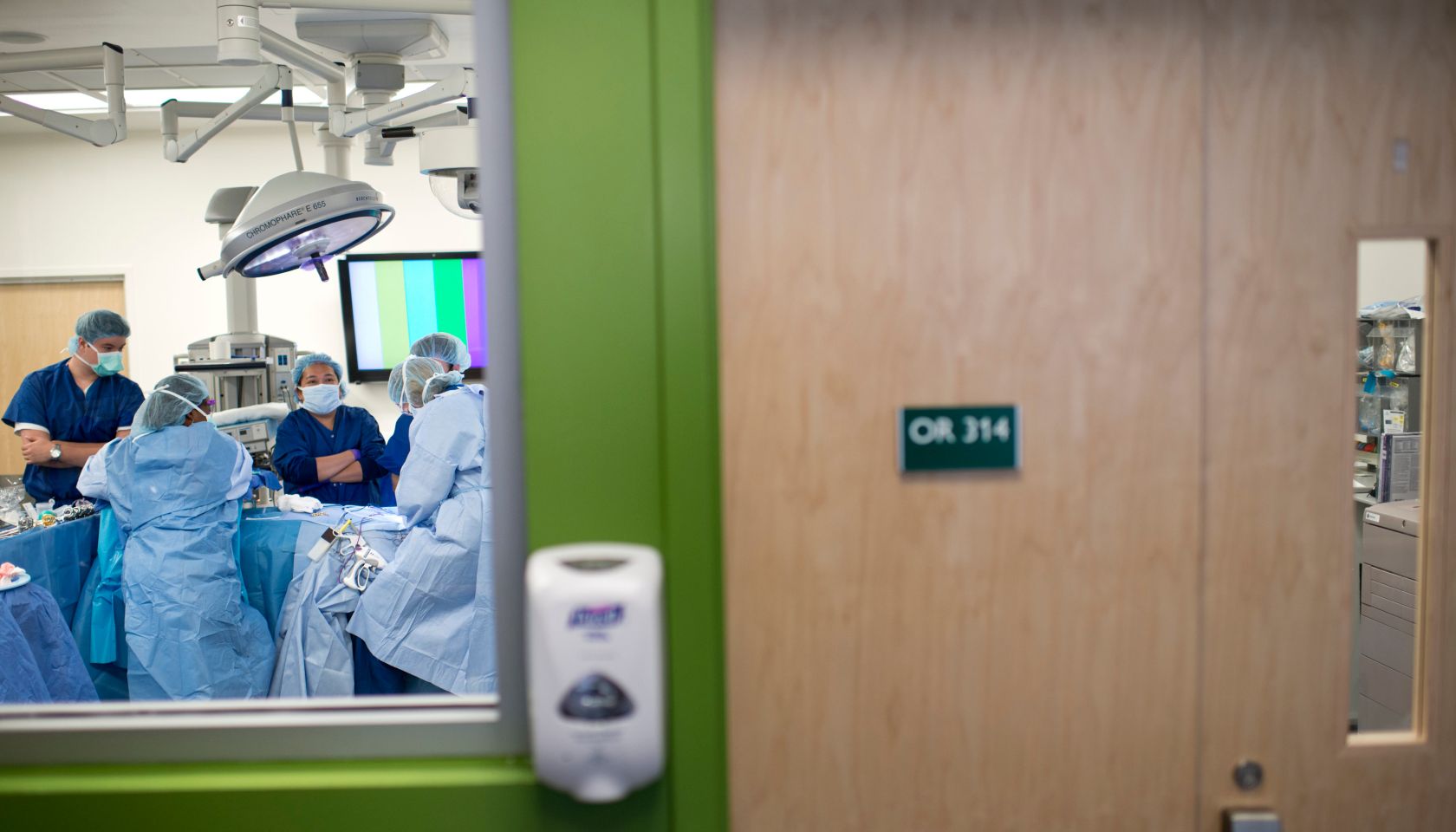 A student and staff watch over a donor d