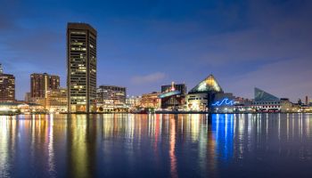 Baltimore inner harbour featuring Baltimore World Trade Center and the Baltimore Aquarium at night
