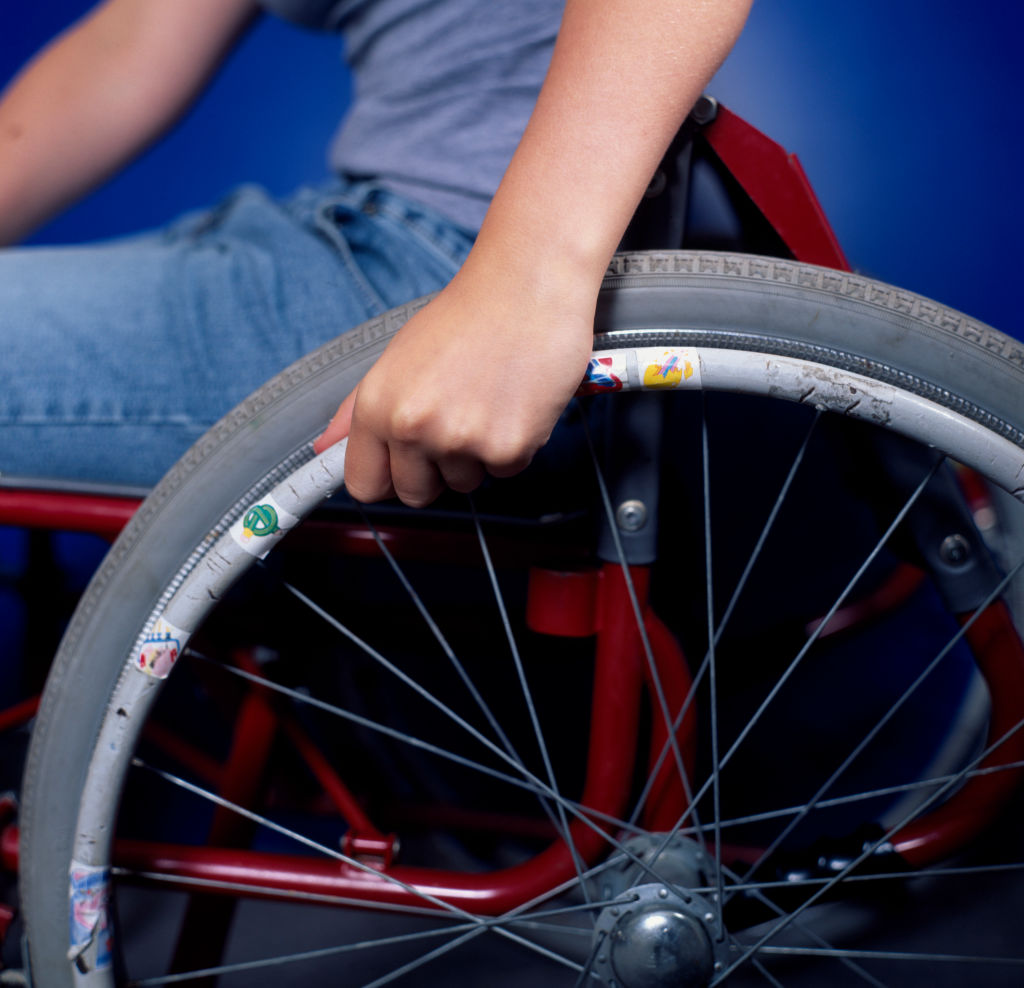 Teenage disabled girl in a wheelchair.