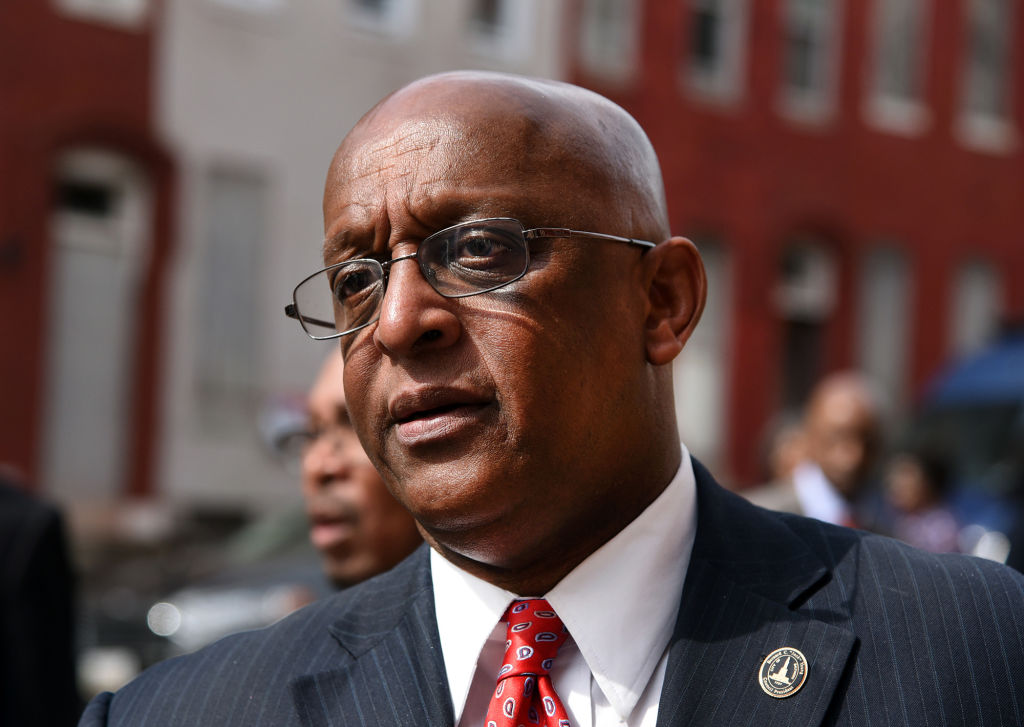 Baltimore's 51st mayor spends his first full day on the job 527 miles away, his phone ringing nonstop