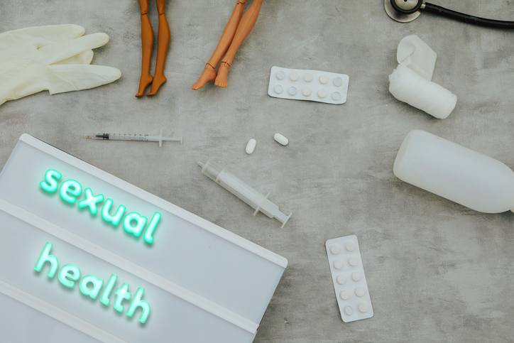 sexual health text and medical items.Top view