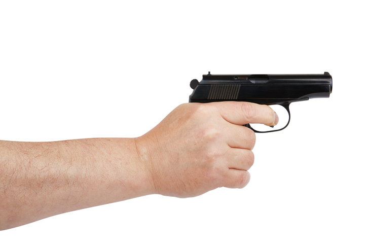 Hand with gun isolated on white background