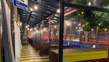 Restaurant outdoor dining shelters on winter's night, Queens, New York