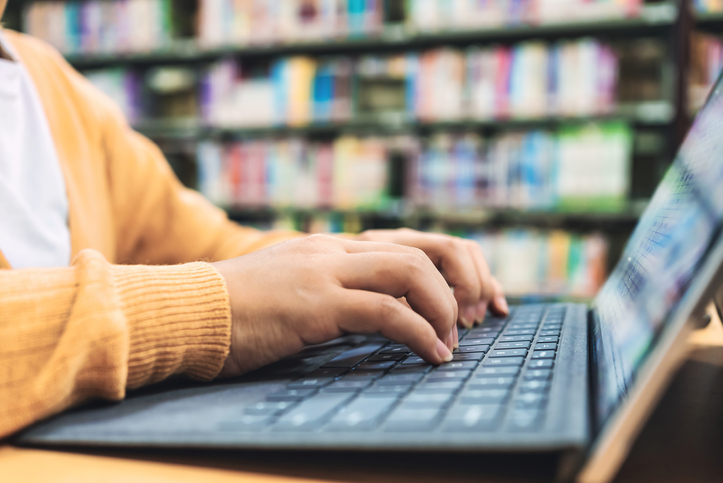 Women use laptops in libraries