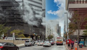 Baltimore Downtown Street Water Steam. Traffic Vehicles. Steam and hot water. Maryland