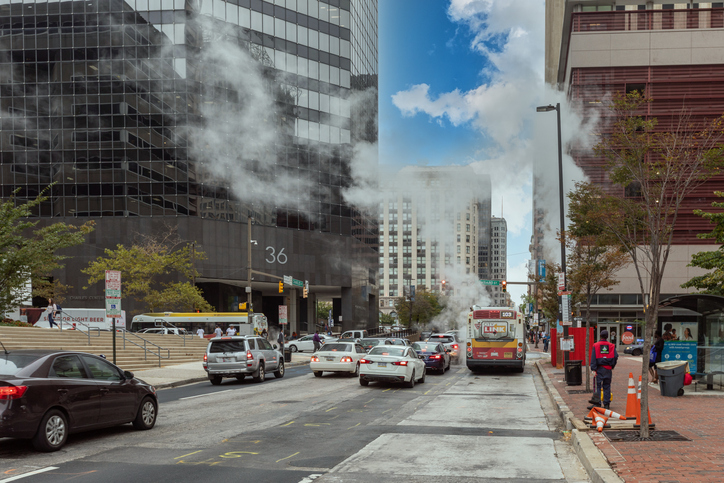 Baltimore Downtown Street Water Steam. Traffic Vehicles. Steam and hot water. Maryland