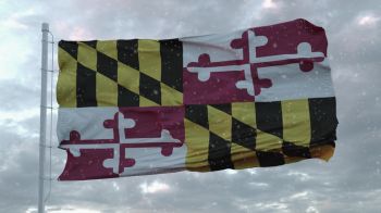 Maryland winter flag with snowflakes background. United States of America. 3d rendering