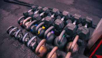Dumbbells and kettlebells on a gym's floor