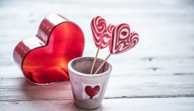 Playing Hearts on White Wooden Background, Valentine´s Day Concept