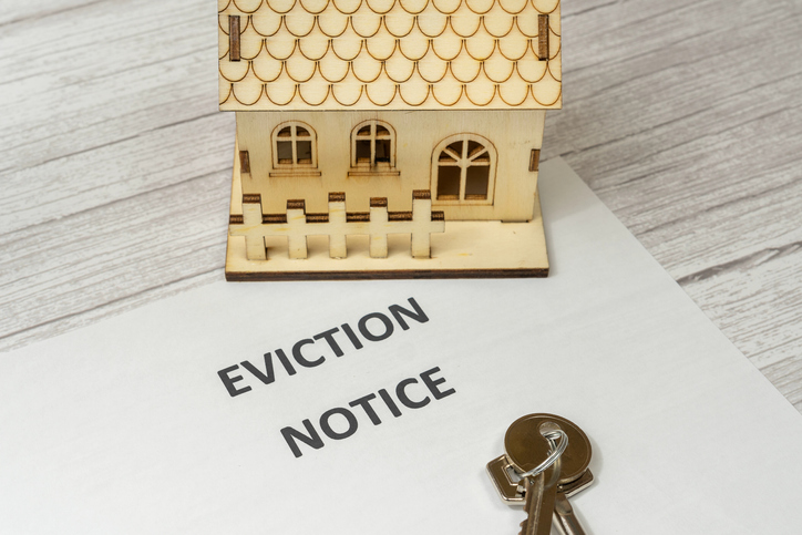 Notice of Eviction from a house. Concept of eviction for non-payment of a mortgage to the bank. Rise in interest rates. Cables and house together with the summons.