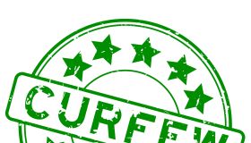 Grunge green curfew word with star icon round rubber seal stamp on white background
