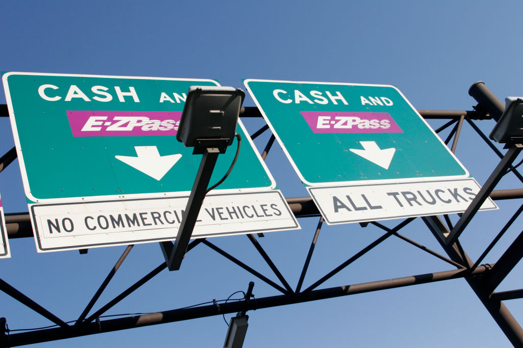 Cash and E-Z Pass signs at the New Jersey Turnpike.