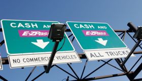 Cash and E-Z Pass signs at the New Jersey Turnpike.