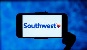 In this photo illustration, the southwest airlines logo is...
