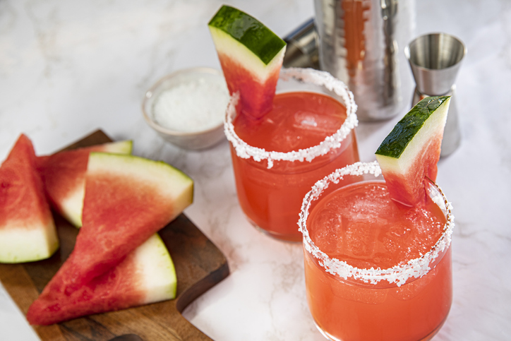 Margarita glass with mixer and Watermelon on a Marble Background