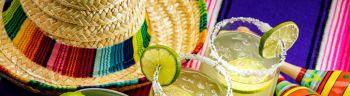 Happy Cinco de Mayo with two Margarita Glasses on a Colorful Background