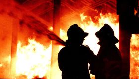 Fire brigade firemen fighting a fire generic