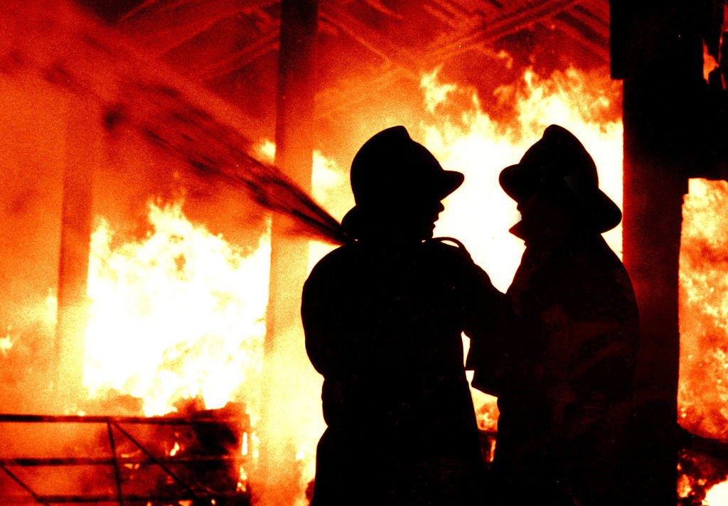 Fire brigade firemen fighting a fire generic