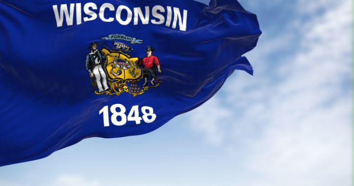 Wisconsin state flag waving on the wind on a clear day
