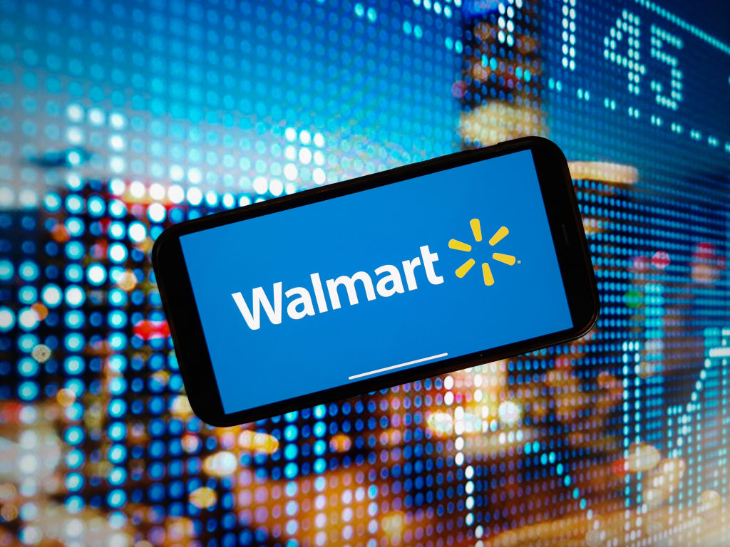 In this photo illustration, the Walmart company logo is seen...