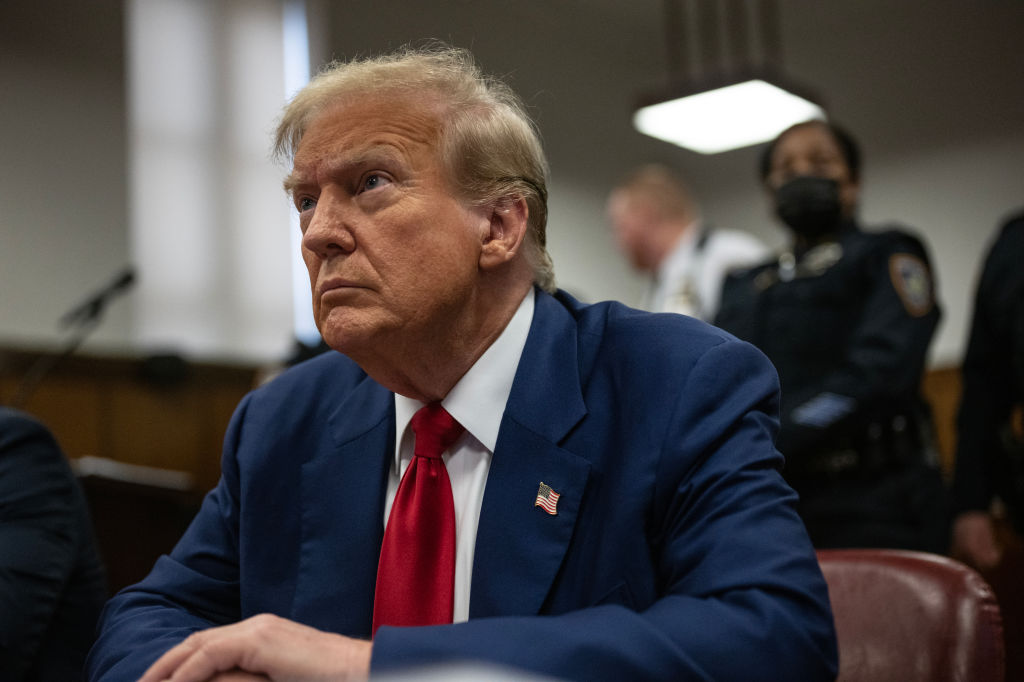 Former president Donald Trump sits in Manhattan Criminal Court