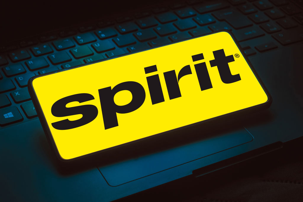 In this photo illustration, the Spirit Airlines logo is...