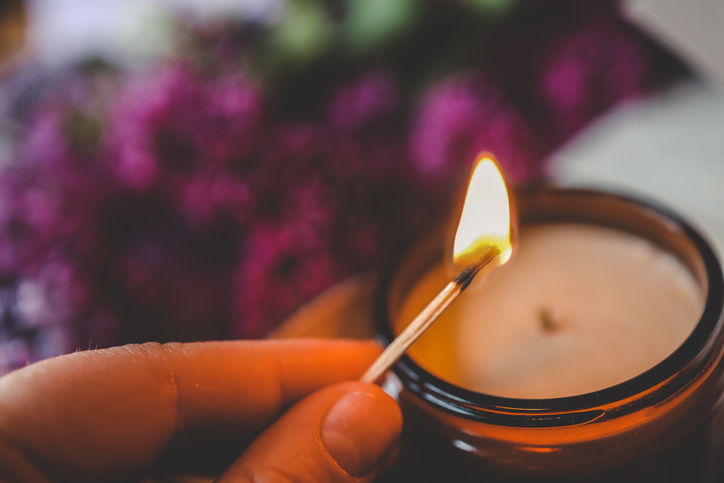 Girl lights a candle, spring aesthetics