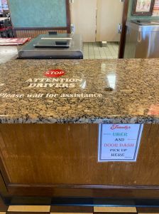 Friendly's restaurant and ice cream shop, Uber and DoorDash driver pick up area, please wait for assistance sign, Long Island, New York