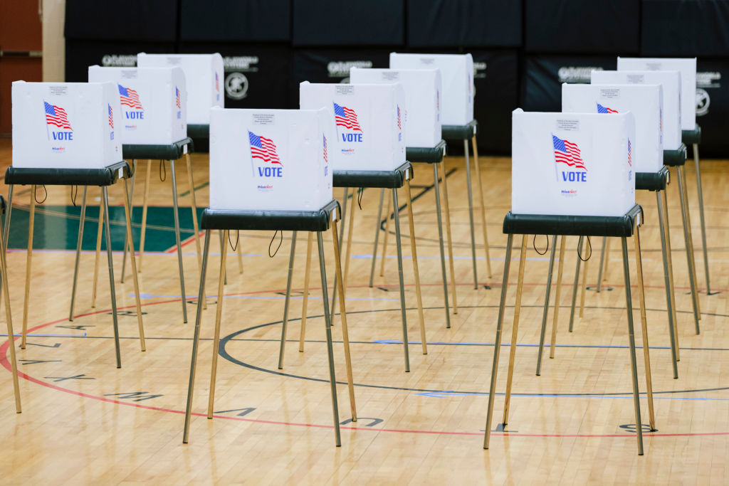 Empty voting booths are seen in the polling station at Davidson