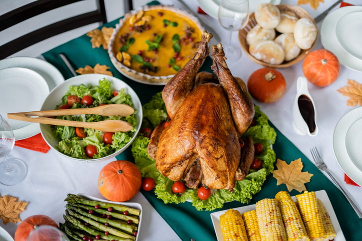 Thanksgiving with a roasted turkey and seasonal dishes and decor
