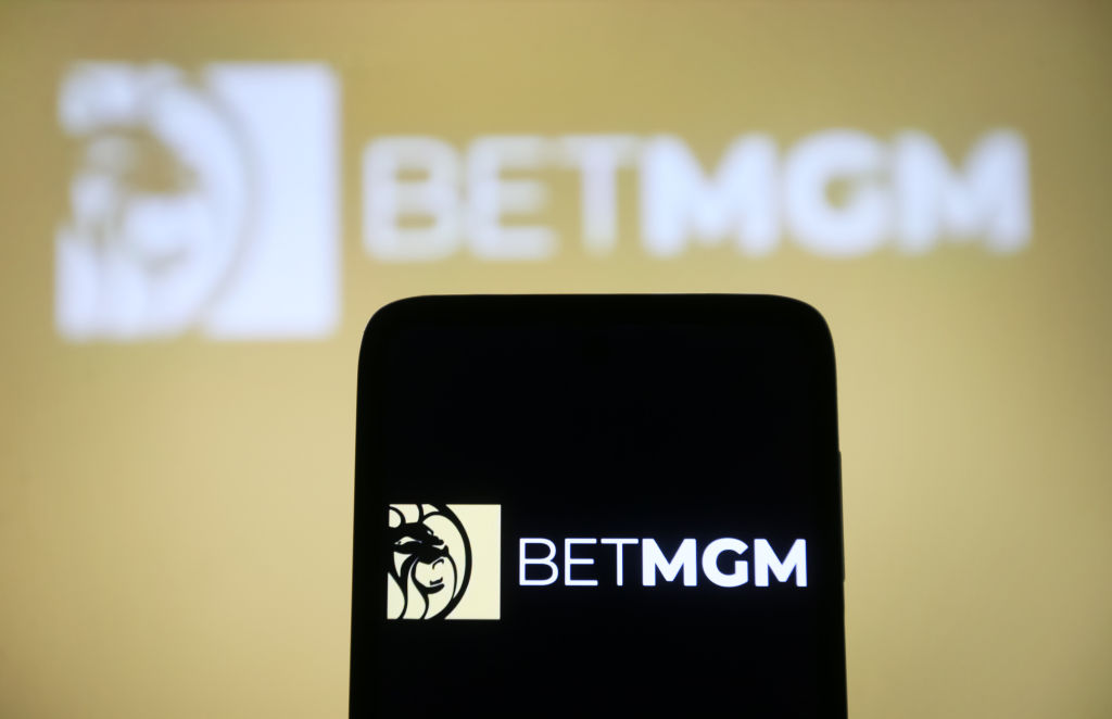 In this photo illustration, a BetMGM logo is seen on a...