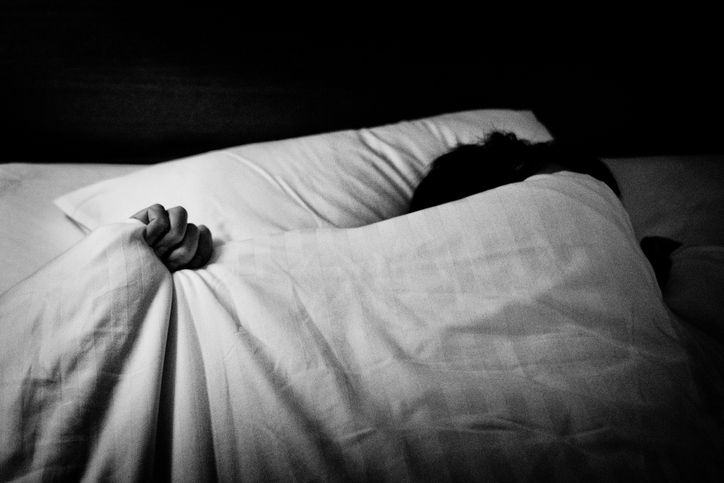 image of a person sleeping in bed