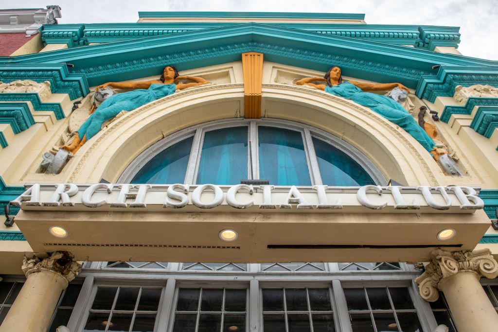 The aged entrance to the Arch Social Club , Baltimore, Maryland, USA