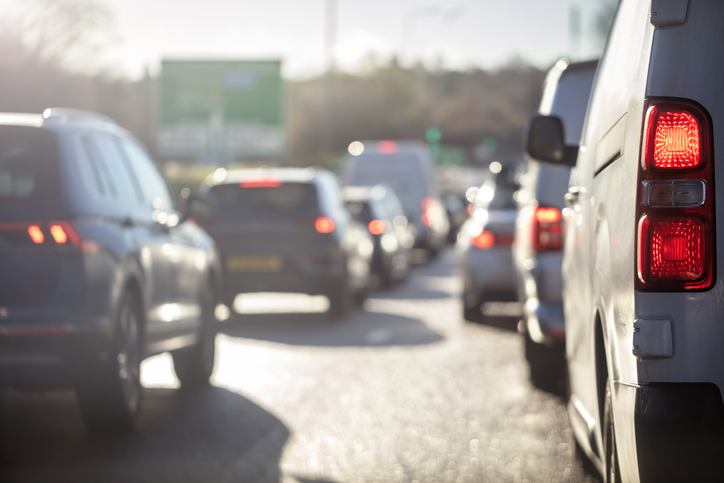 Traffic jam congestion with rows of cars on highway or motorway in rush hour