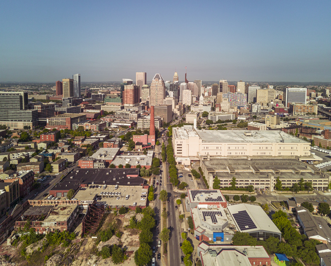 Gentrification and urban sprawl in Baltimore, Maryland. Historical Hendler Creamery site and solar panel buildings line the street