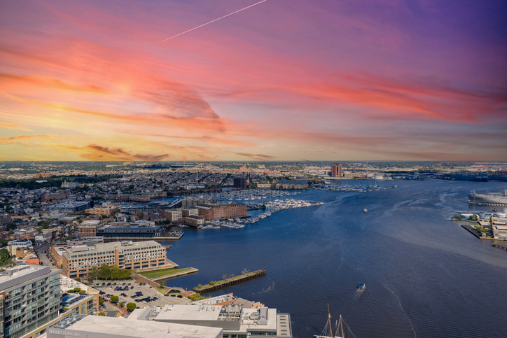 Aerial shot of hotels, apartments and office buildings in the skyline along the Patapsco River in Baltimore Maryland USA