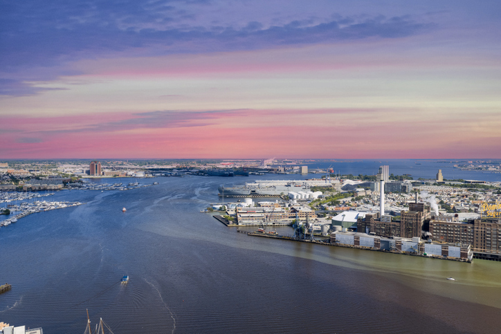 Aerial shot of hotels, apartments and office buildings in the skyline along the Patapsco River in Baltimore Maryland USA
